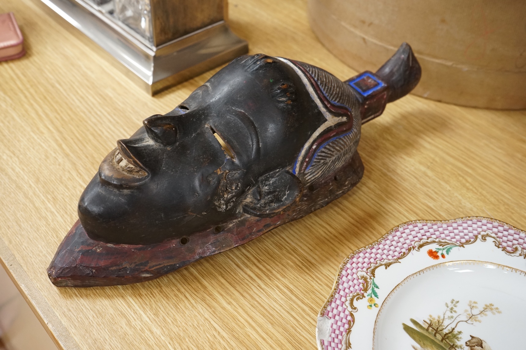 A carved African Ivory Coast mask, 39cm high